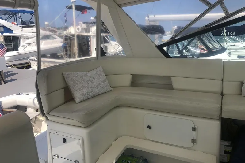  Yacht Photos Pics 1998 Tiara Yachts 3700 Open interior with cushioned seating and decorative pillow.