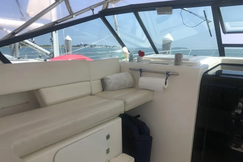  Yacht Photos Pics 1998 Tiara Yachts 3700 Open interior with white seating and ocean view.