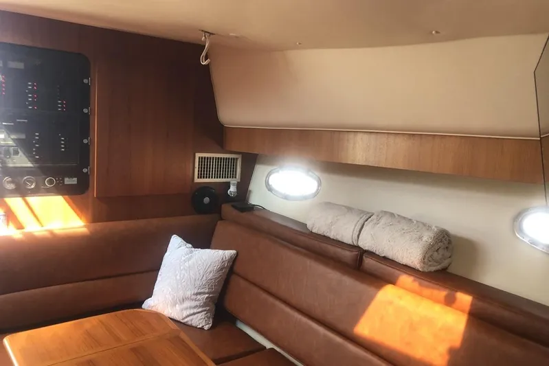  Yacht Photos Pics 1998 Tiara Yachts 3700 Open interior with leather seating and wooden accents.