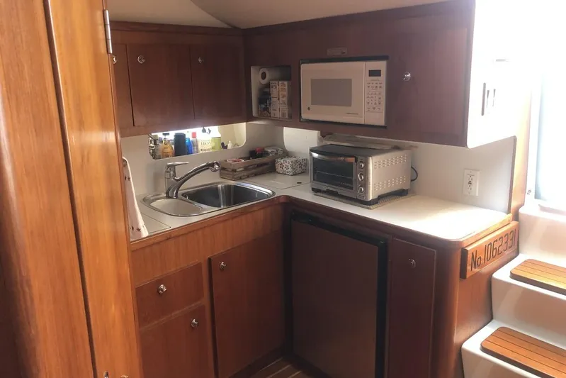  Yacht Photos Pics 1998 Tiara Yachts 3700 Open galley with sink, microwave, and toaster oven.