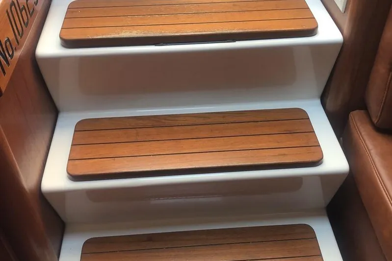  Yacht Photos Pics Wooden steps on a 1998 Tiara Yachts 3700 Open, showcasing elegant design.