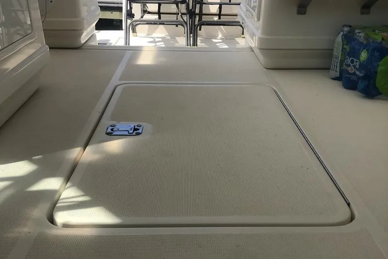  Yacht Photos Pics 1998 Tiara Yachts 3700 Open deck with storage hatch and seating area.