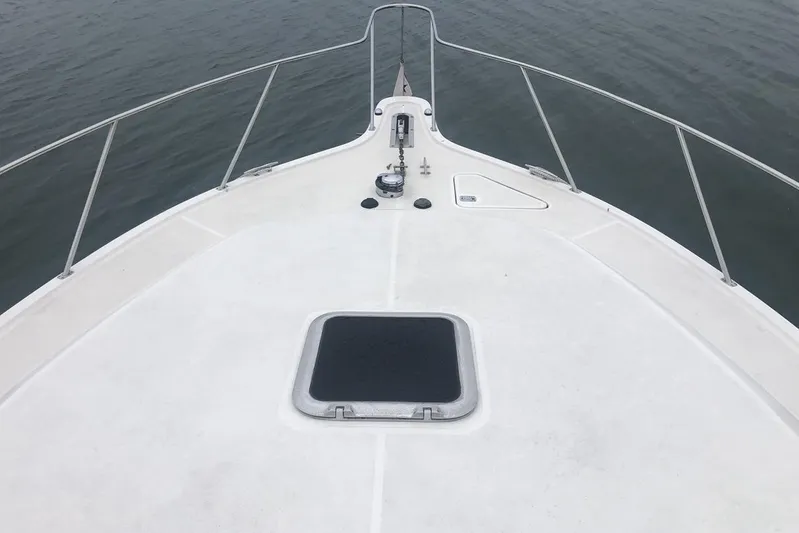  Yacht Photos Pics Bow view of 1998 Tiara Yachts 3700 Open on calm water.