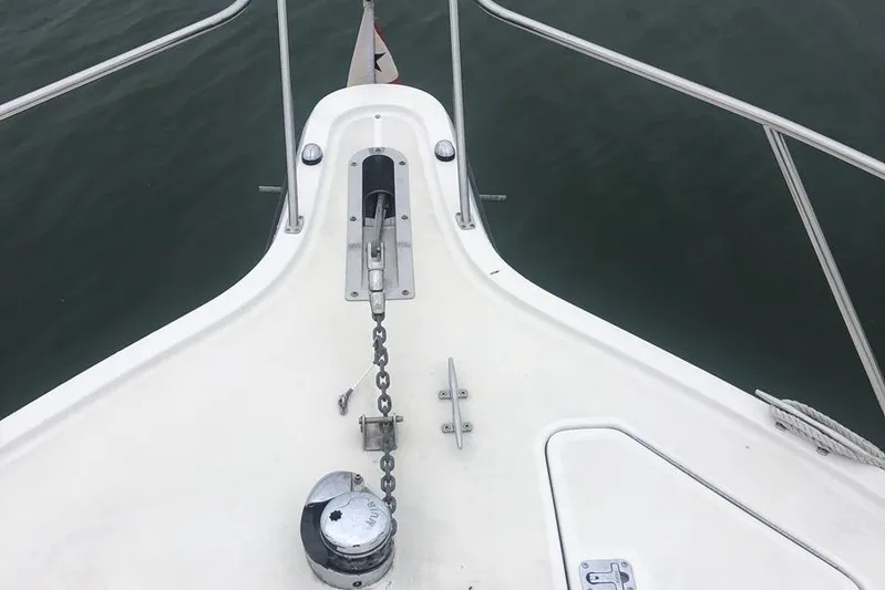  Yacht Photos Pics Bow view of 1998 Tiara Yachts 3700 Open with anchor chain and railing.