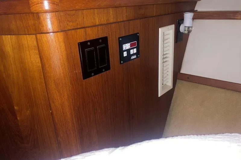  Yacht Photos Pics 1998 Tiara Yachts 3700 Open interior with wooden paneling and control switches.