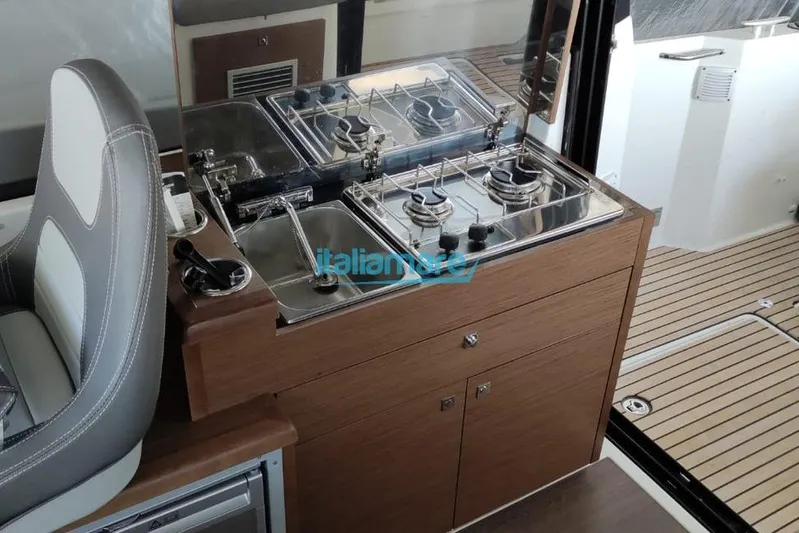 Natasha Yacht Photos Pics Interior of 2019 Jeanneau Merry Fisher 895 with compact kitchen setup.