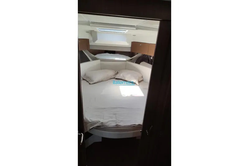 Natasha Yacht Photos Pics Interior cabin of 2019 Jeanneau Merry Fisher 895 with cozy bedding.