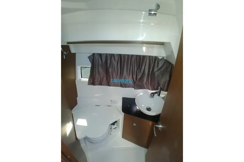 Natasha Yacht Photos Pics 2019 Jeanneau Merry Fisher 895 bathroom interior with sink and toilet.
