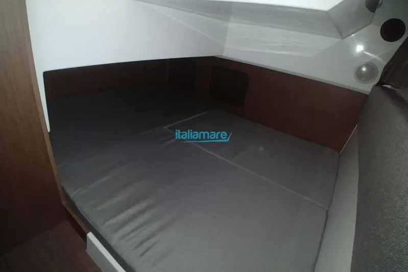 Natasha Yacht Photos Pics Interior cabin of 2019 Jeanneau Merry Fisher 895 boat, featuring a cozy sleeping area.