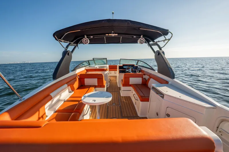 Ceci Yacht Photos Pics 2019 Sea Ray SDX 290 Outboard boat with orange seating, on open water.