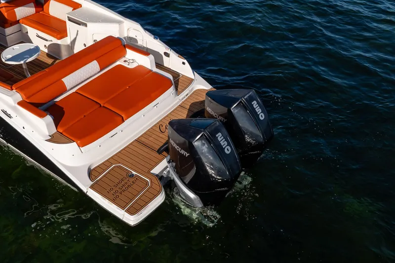 Ceci Yacht Photos Pics 2019 Sea Ray SDX 290 Outboard with twin Mercury engines and orange seating on water.