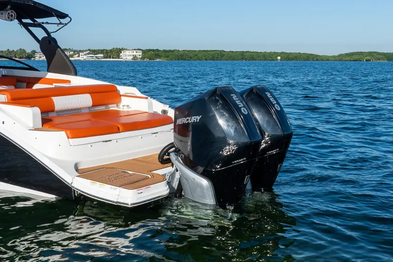 Ceci Yacht Photos Pics 2019 Sea Ray SDX 290 Outboard with dual Mercury engines on a calm lake.