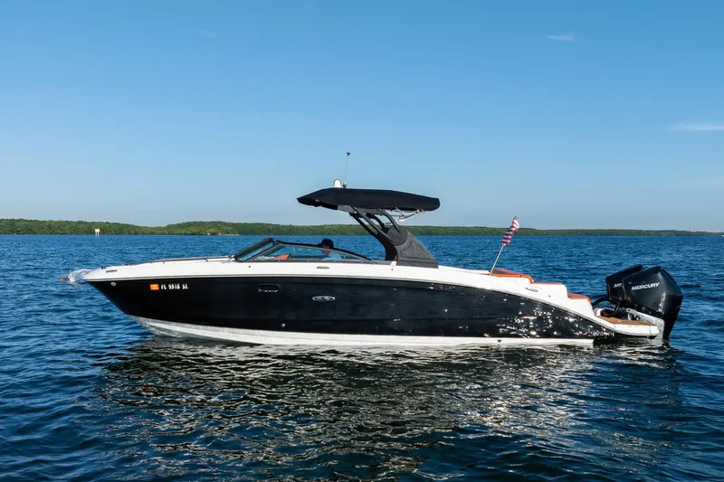 Ceci Yacht Photos Pics 2019 Sea Ray SDX 290 Outboard boat on calm blue water under clear sky.