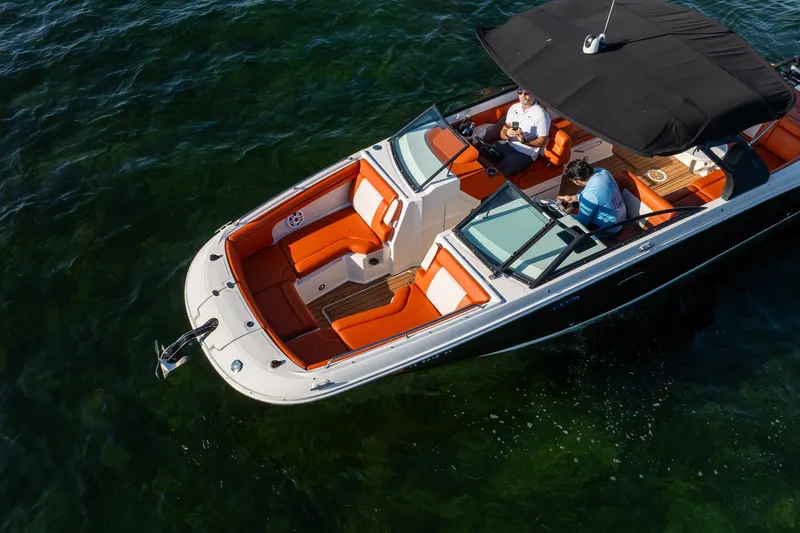Ceci Yacht Photos Pics 2019 Sea Ray SDX 290 Outboard boat with orange seating on clear water.