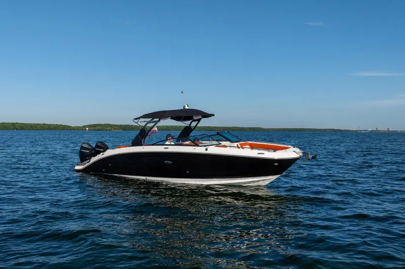 Ceci Yacht Photos Pics 2019 Sea Ray SDX 290 Outboard boat cruising on open water under clear blue sky.