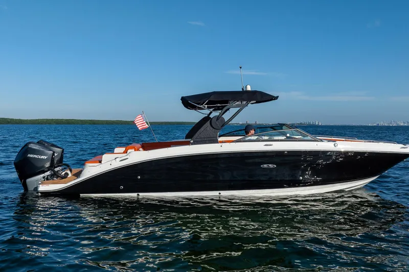 Ceci Yacht Photos Pics 2019 Sea Ray SDX 290 Outboard boat cruising on open water under clear blue sky.