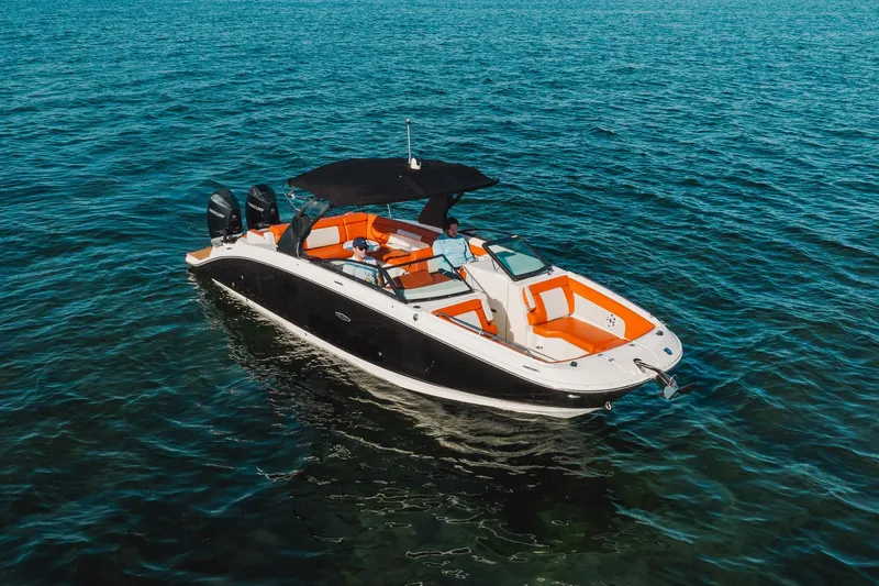 Ceci Yacht Photos Pics 2019 Sea Ray SDX 290 Outboard boat on open water, featuring orange seating and black canopy.