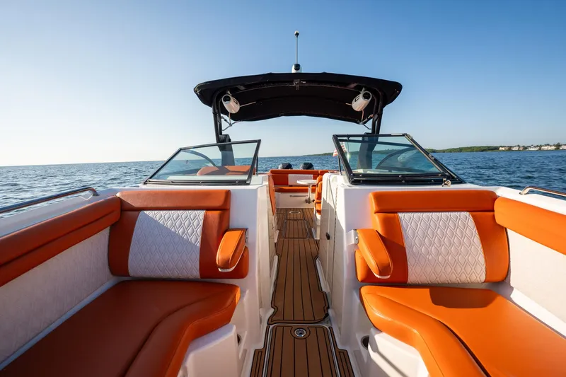 Ceci Yacht Photos Pics 2019 Sea Ray SDX 290 Outboard boat with orange seating on open water.