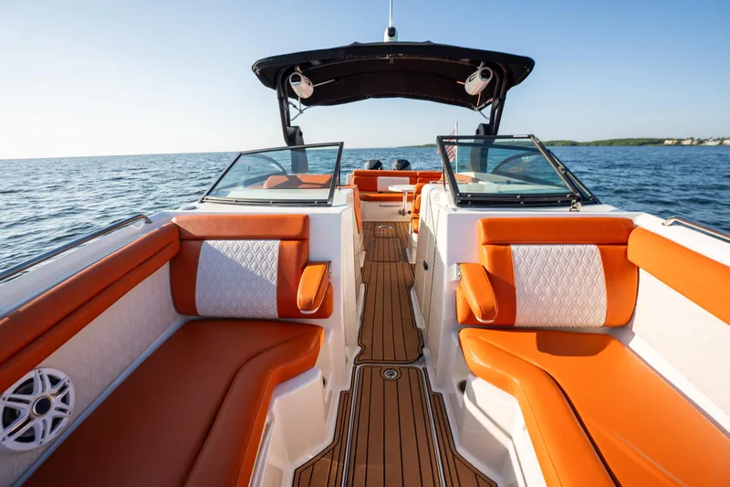 Ceci Yacht Photos Pics 2019 Sea Ray SDX 290 Outboard boat with orange seating on open water.