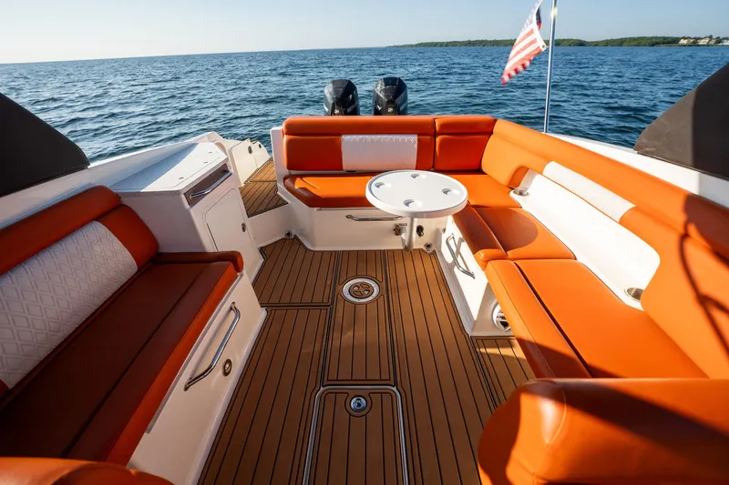Ceci Yacht Photos Pics 2019 Sea Ray SDX 290 Outboard boat with orange seating and wooden deck.