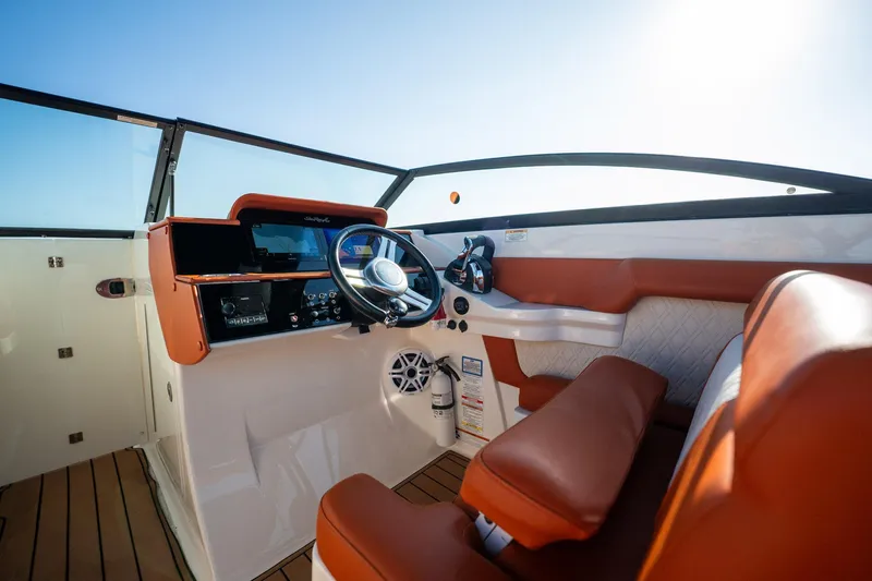 Ceci Yacht Photos Pics 2019 Sea Ray SDX 290 Outboard helm with leather seats and modern controls.