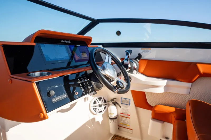Ceci Yacht Photos Pics 2019 Sea Ray SDX 290 Outboard boat dashboard with modern controls and orange seating.