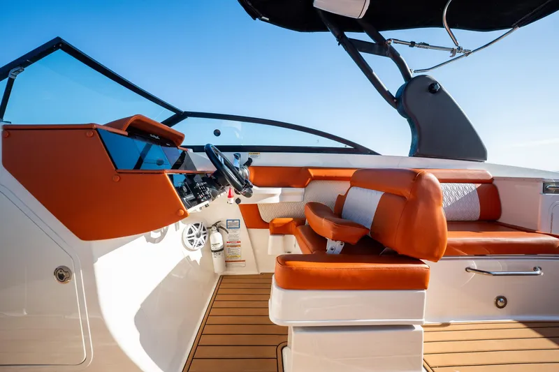 Ceci Yacht Photos Pics 2019 Sea Ray SDX 290 Outboard boat interior with orange seating and modern dashboard.
