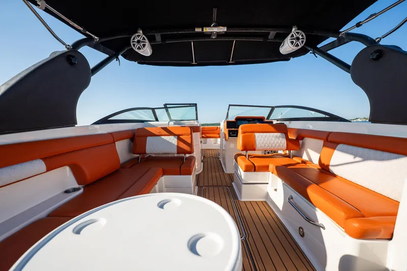 Ceci Yacht Photos Pics 2019 Sea Ray SDX 290 Outboard interior with orange seating and sleek design.