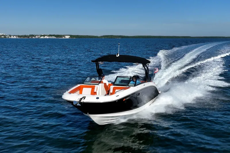 Ceci Yacht Photos Pics 2019 Sea Ray SDX 290 Outboard cruising on open water under clear blue skies.