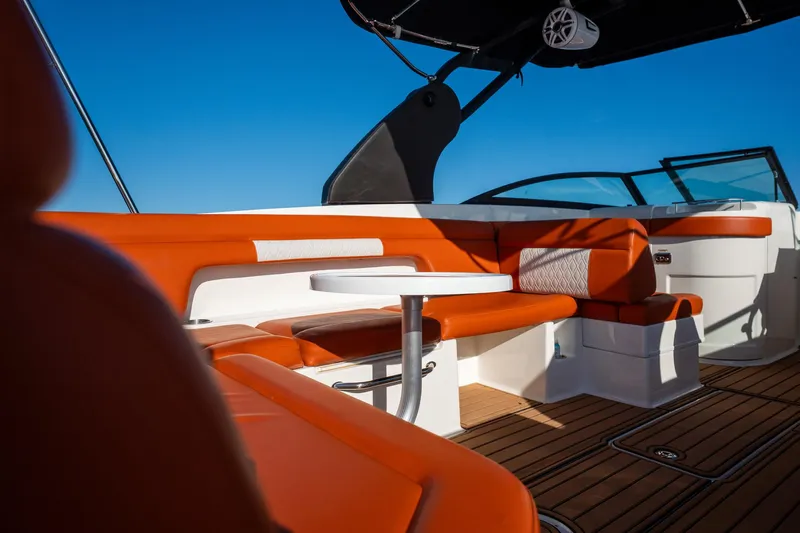 Ceci Yacht Photos Pics 2019 Sea Ray SDX 290 Outboard interior with orange seating and sleek design.