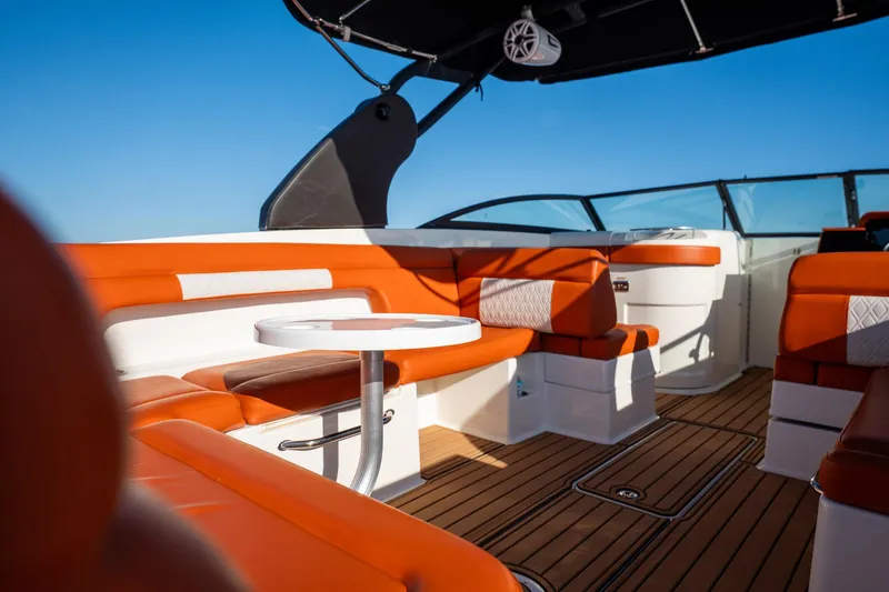 Ceci Yacht Photos Pics 2019 Sea Ray SDX 290 Outboard boat interior with orange seating and wooden flooring.