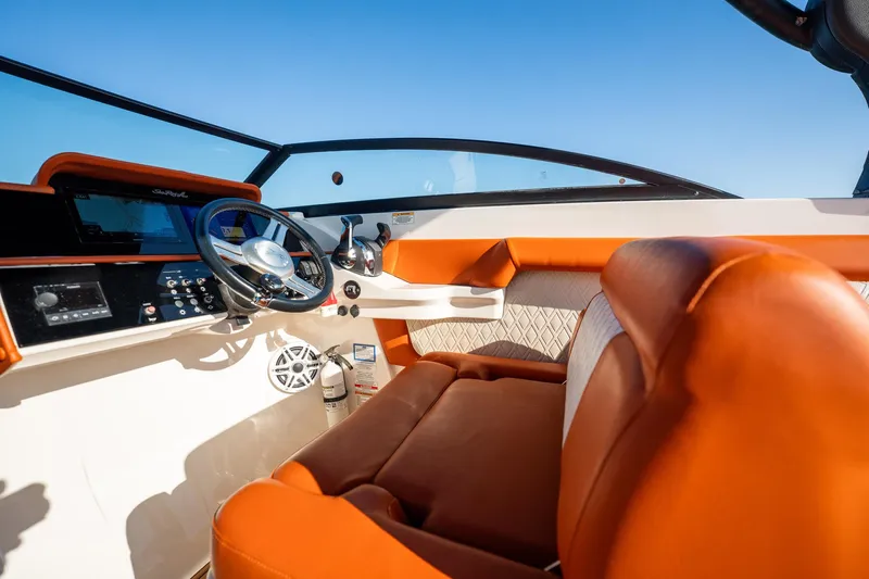 Ceci Yacht Photos Pics 2019 Sea Ray SDX 290 Outboard boat interior with orange seating and modern dashboard.