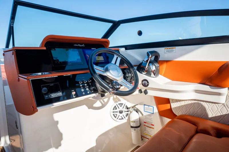 Ceci Yacht Photos Pics 2019 Sea Ray SDX 290 Outboard helm with modern controls and orange seating.