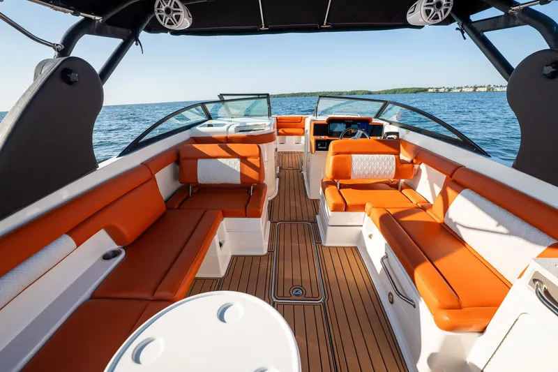 Ceci Yacht Photos Pics 2019 Sea Ray SDX 290 Outboard boat with orange seating, spacious deck, and ocean view.