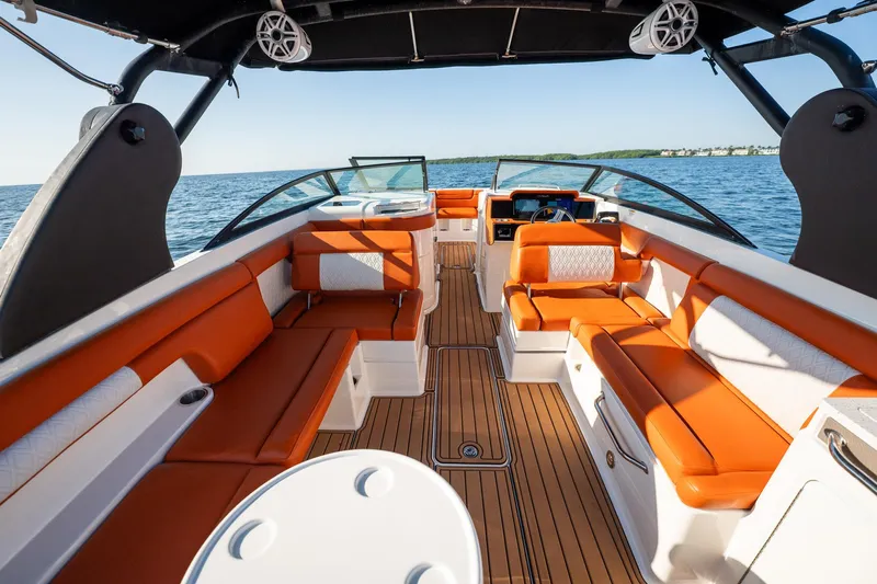 Ceci Yacht Photos Pics 2019 Sea Ray SDX 290 Outboard boat interior with orange seating and wood flooring.