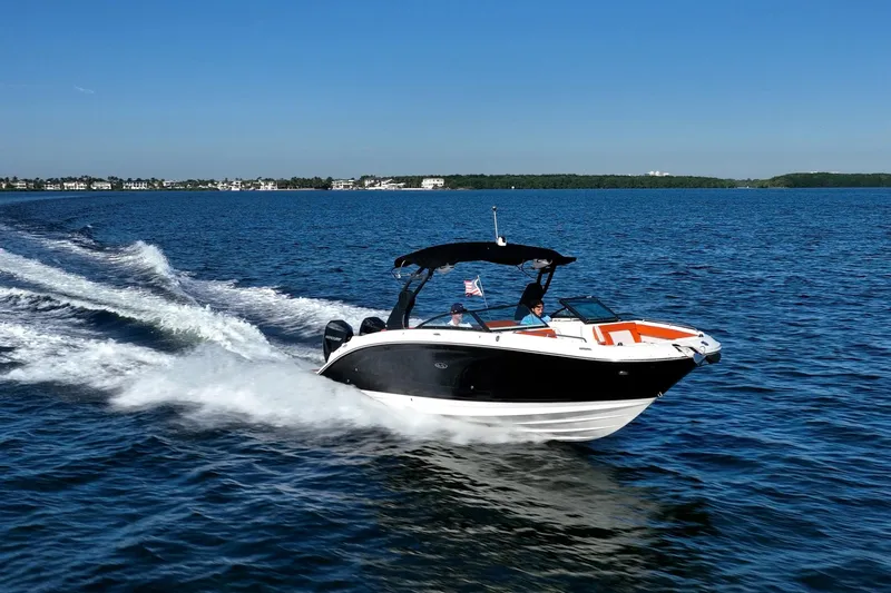 Ceci Yacht Photos Pics 2019 Sea Ray SDX 290 Outboard cruising on open water under clear blue skies.