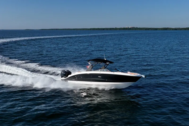 Ceci Yacht Photos Pics 2019 Sea Ray SDX 290 Outboard cruising on open water under clear blue sky.
