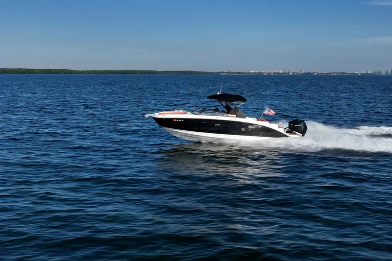 Ceci Yacht Photos Pics 2019 Sea Ray SDX 290 Outboard cruising on open water under clear blue skies.