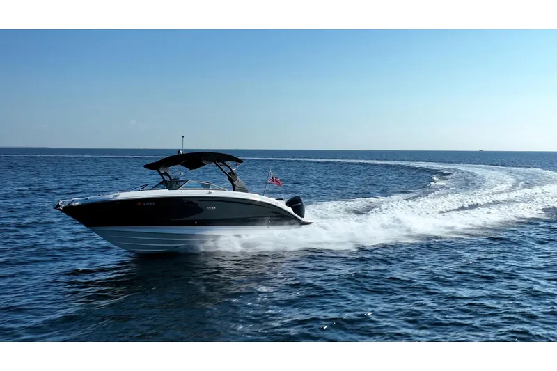 Ceci Yacht Photos Pics 2019 Sea Ray SDX 290 Outboard cruising on open water under clear blue sky.