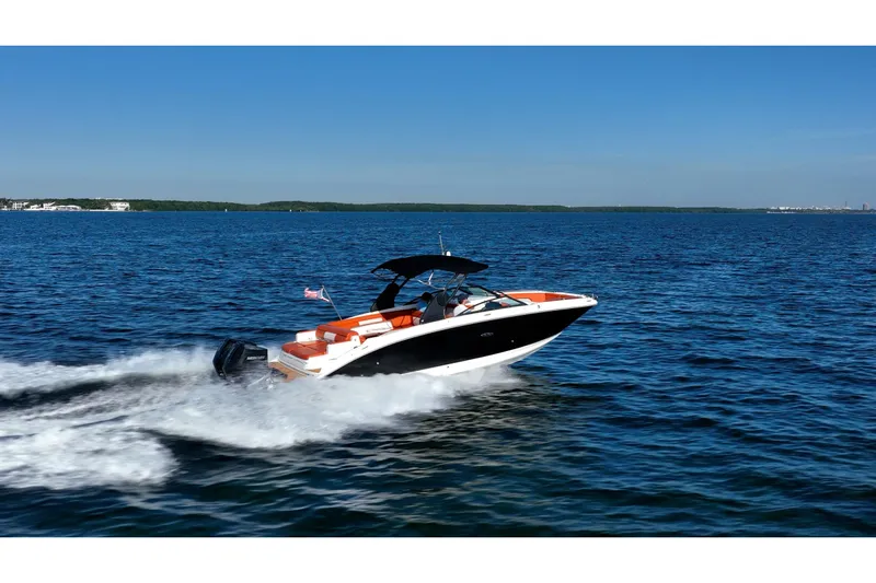 Ceci Yacht Photos Pics 2019 Sea Ray SDX 290 Outboard cruising on open water under clear blue skies.