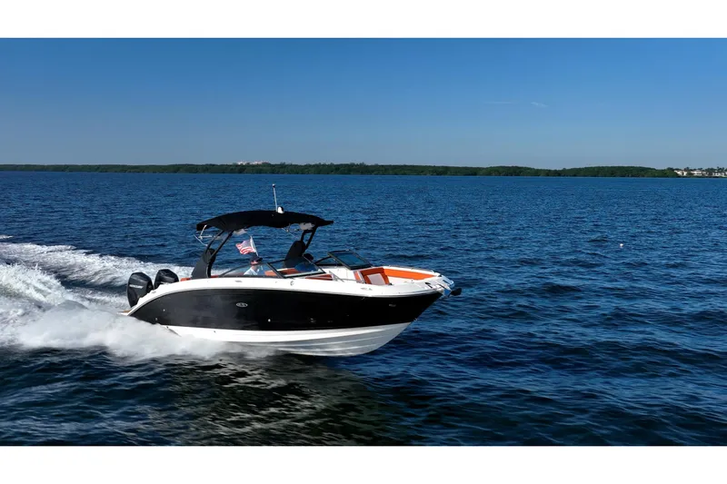 Ceci Yacht Photos Pics 2019 Sea Ray SDX 290 Outboard cruising on a clear blue lake.