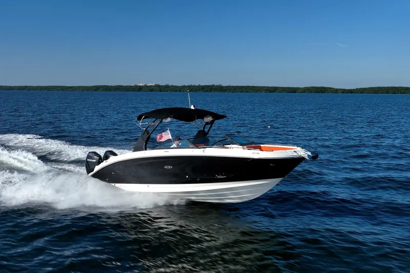 Ceci Yacht Photos Pics 2019 Sea Ray SDX 290 Outboard cruising on open water under clear blue sky.
