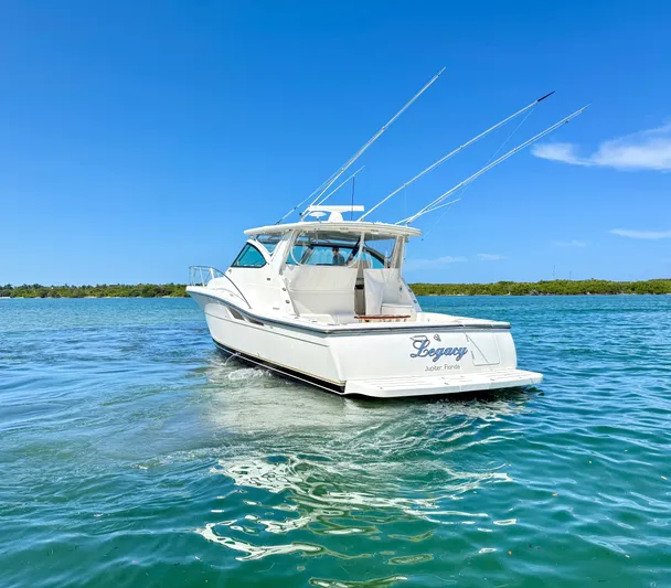 Legacy Yacht Photos Pics 2003 Tiara Yachts 4200 Open cruising on clear blue waters under a sunny sky.