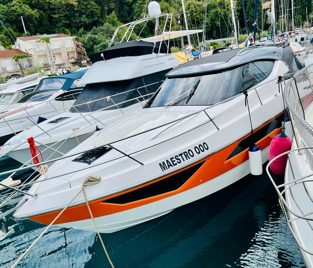 2021 Focus Power 36 yacht "Maestro 000" docked in a marina.