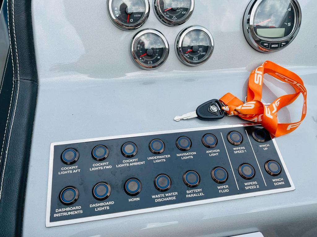 Control panel of a 2021 Focus Power 36 boat with key and switches.