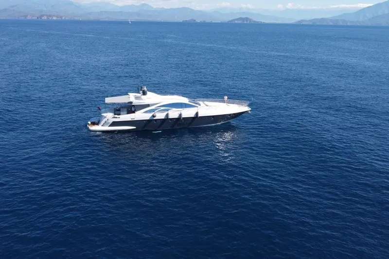  Yacht Photos Pics Luxury 2007 Azimut 86S yacht cruising on open sea with scenic mountain backdrop.