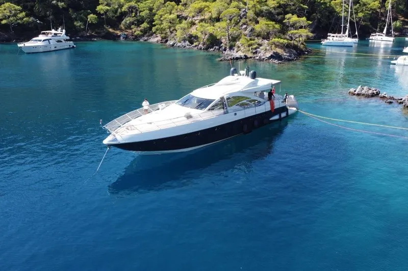  Yacht Photos Pics Luxury 2007 Azimut 86S yacht anchored in a serene, turquoise bay.