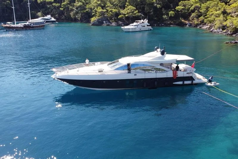  Yacht Photos Pics Luxury 2007 Azimut 86S yacht anchored in a serene, turquoise bay.