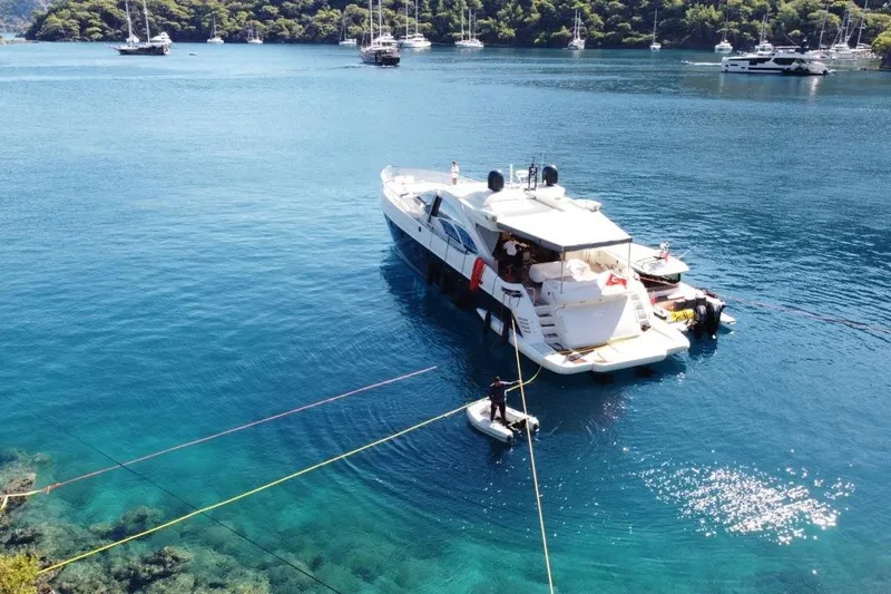  Yacht Photos Pics Luxury Azimut 86S yacht anchored in clear blue waters, surrounded by other boats, 2007 model.