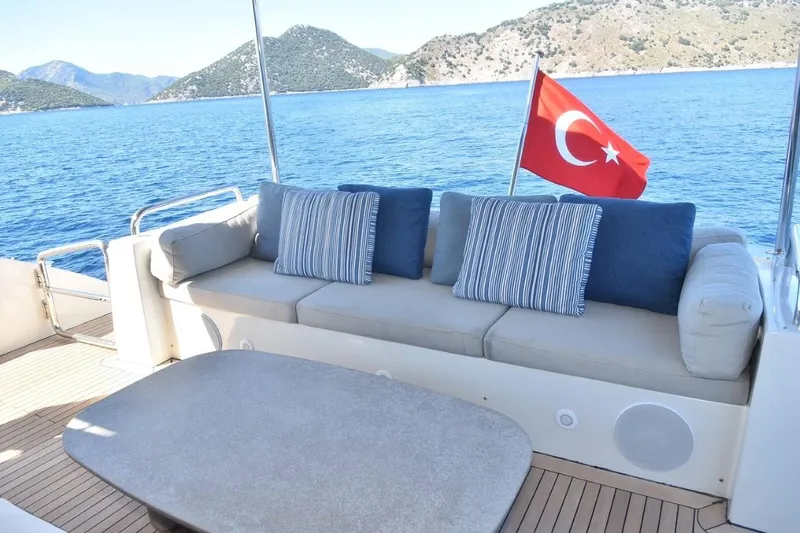  Yacht Photos Pics Luxury Azimut 86S yacht deck with Turkish flag, scenic sea and mountain view.